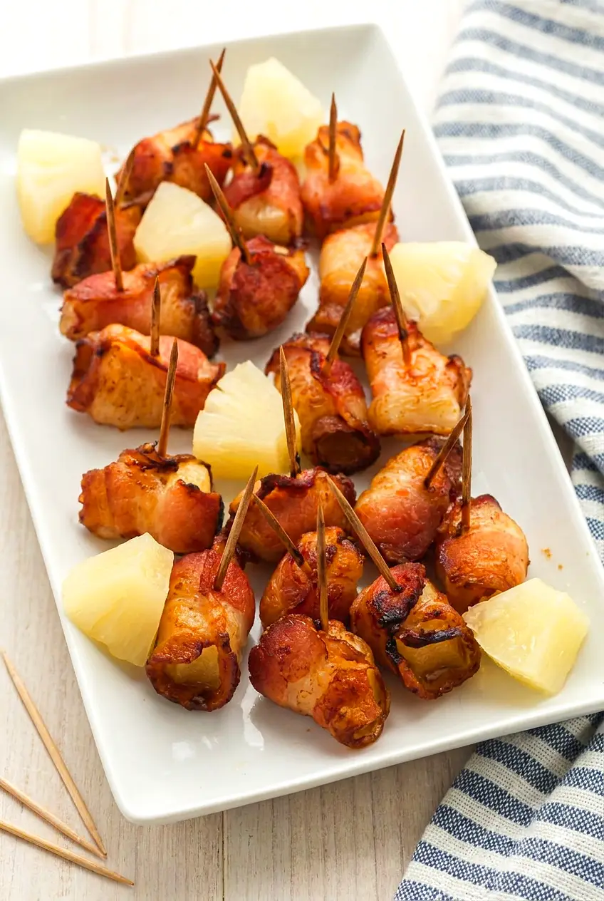 Air Fryer Bacon Pineapple served on a platter with browned bacon edges and juicy pineapple bites